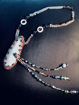 Beaded necklace featuring Angel Wing shell