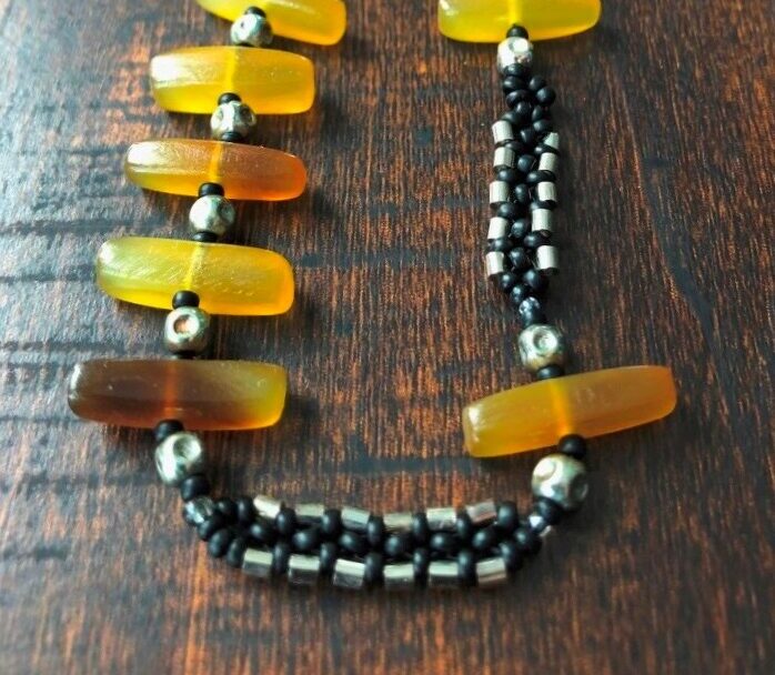 Beaded necklace with stone, metal and glass beads