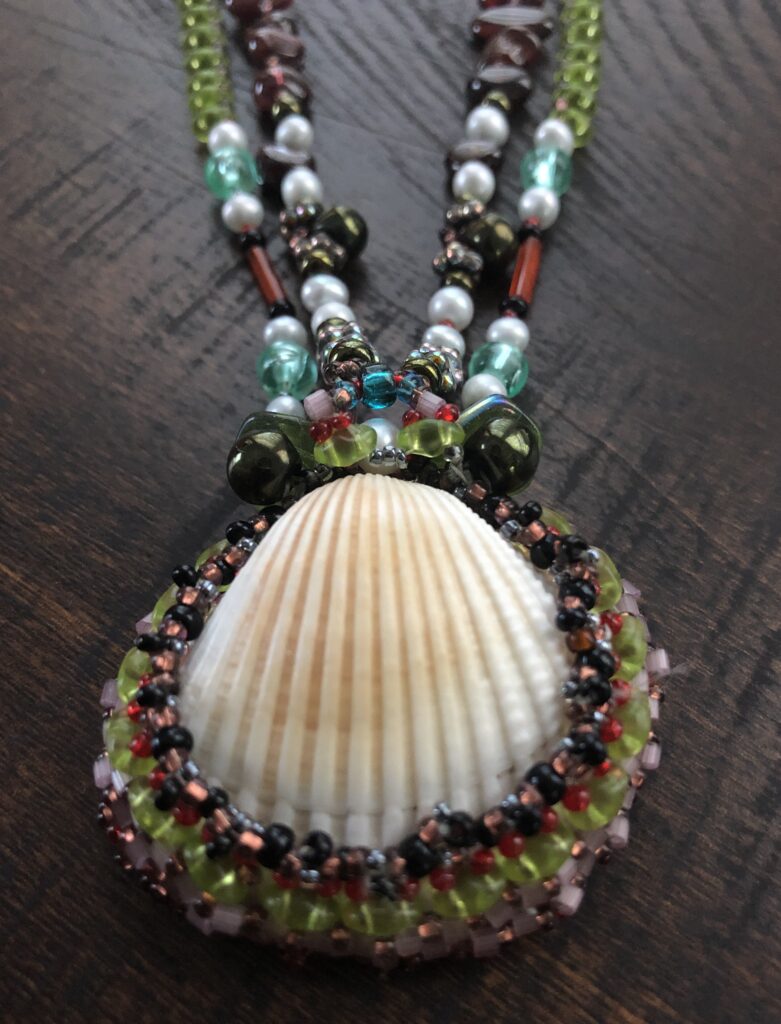Beaded necklace with natural shell