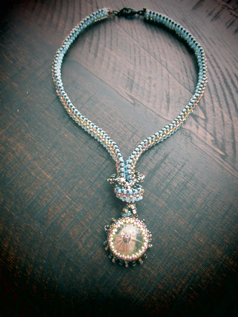 Beaded necklace with natural shell