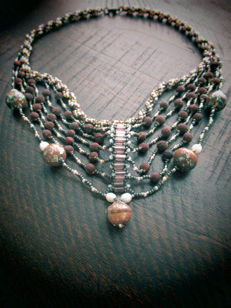 Beaded necklace with natural seeds